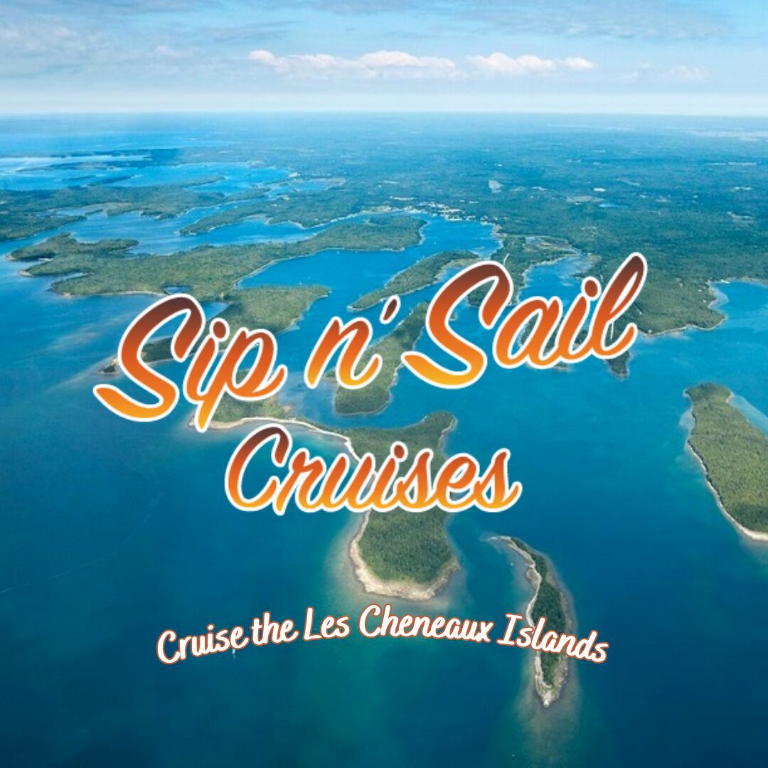 Aerial view of the Les Cheneaux Islands with Sip n' Sail Cruises written in bold, orange text, promoting scenic island cruises.